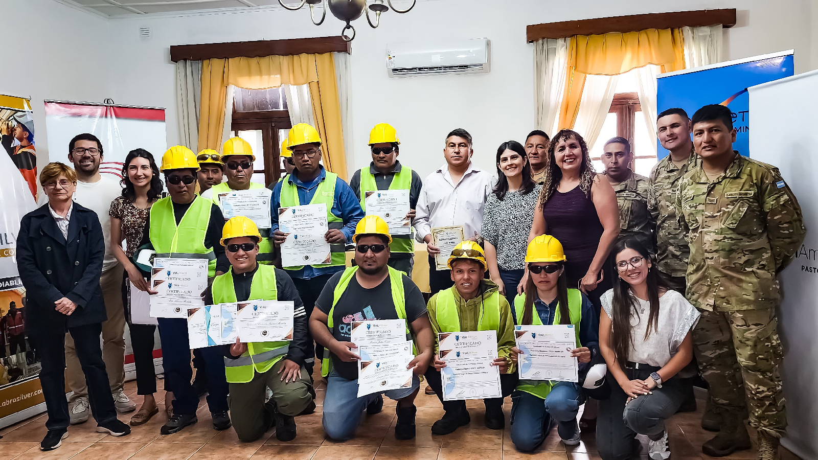 Team members with certificates of completion